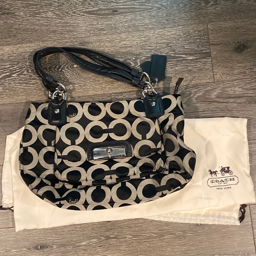 Coach purse, black and white, orange interior